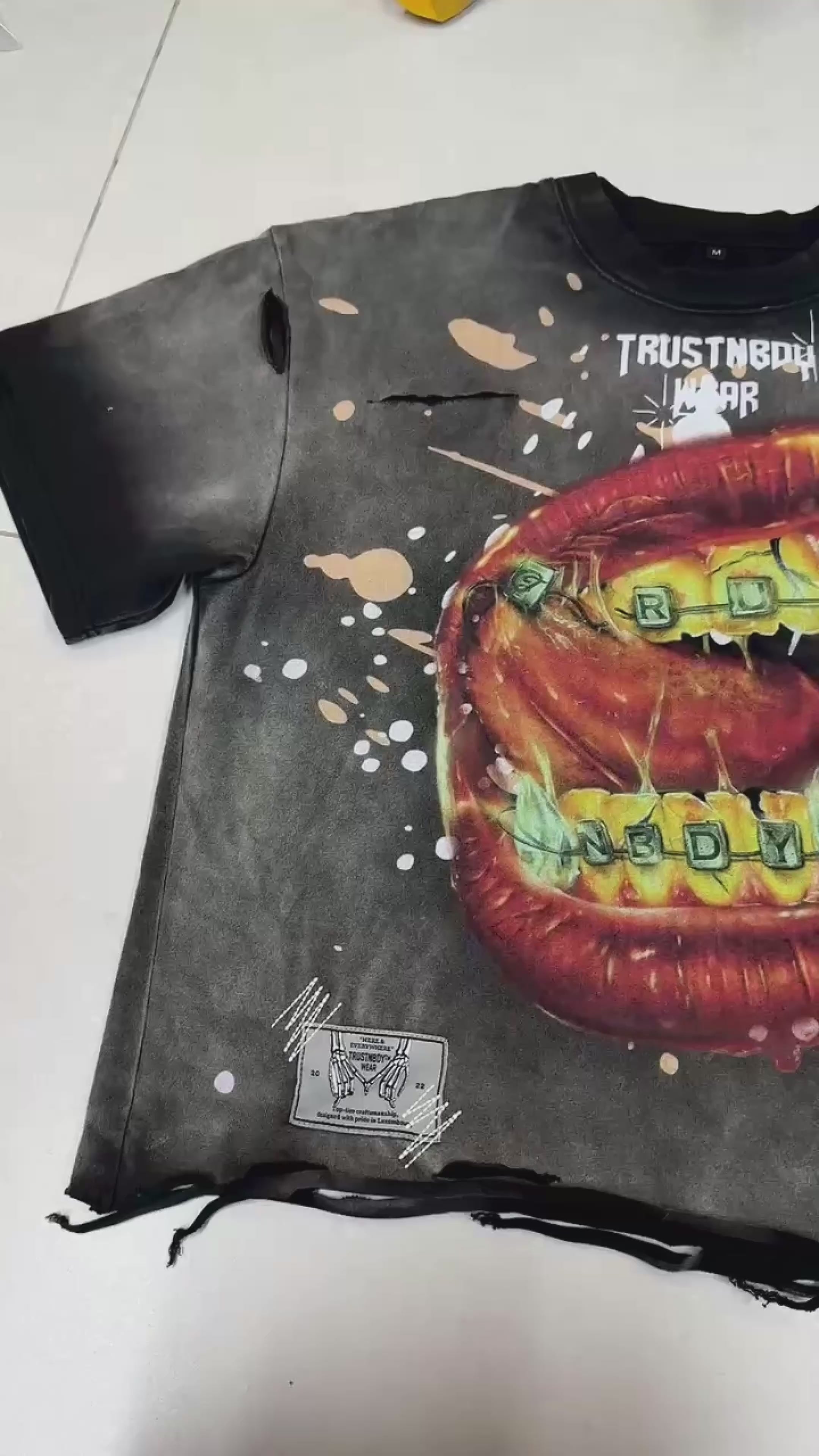 Load video: Details of the “THA PRICE OF TRUTH” Tee — oversized fit, premium fabric, and exclusive TRUSTNBDYWEAR® graphic inspired by the concept of the price of truth.